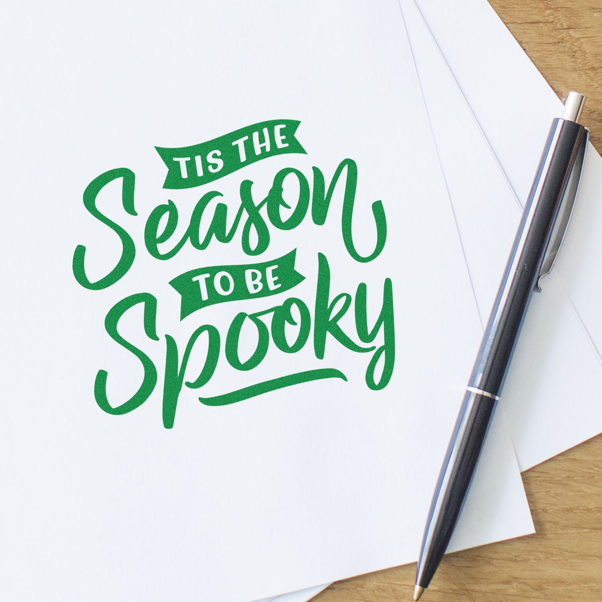 Season To Be Spooky rubber stamp shown in green ink, stamped for projects such as costume album page.