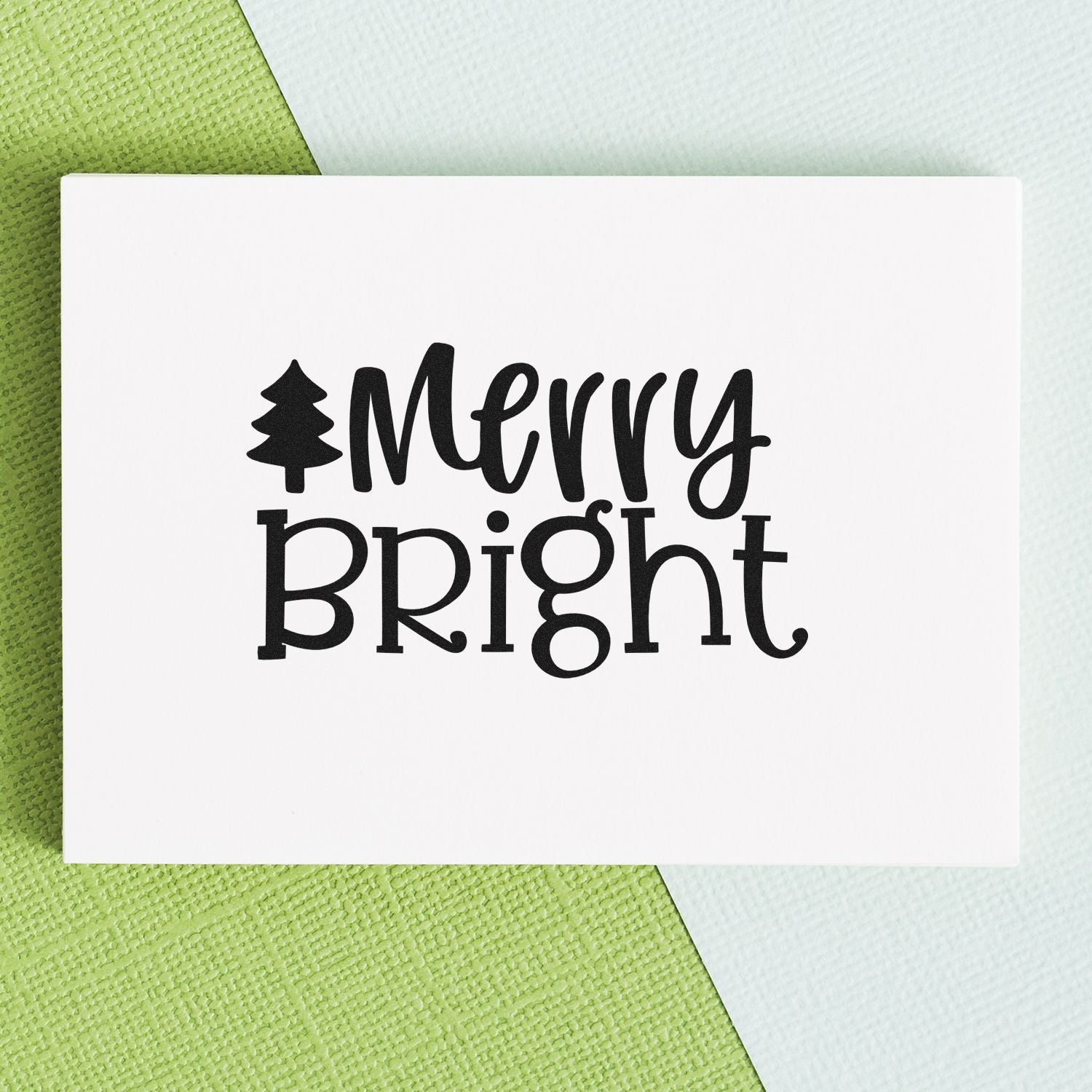 Merry Bright Christmas rubber stamp design on white card, featuring a tree icon for holiday card making and DIY crafts.