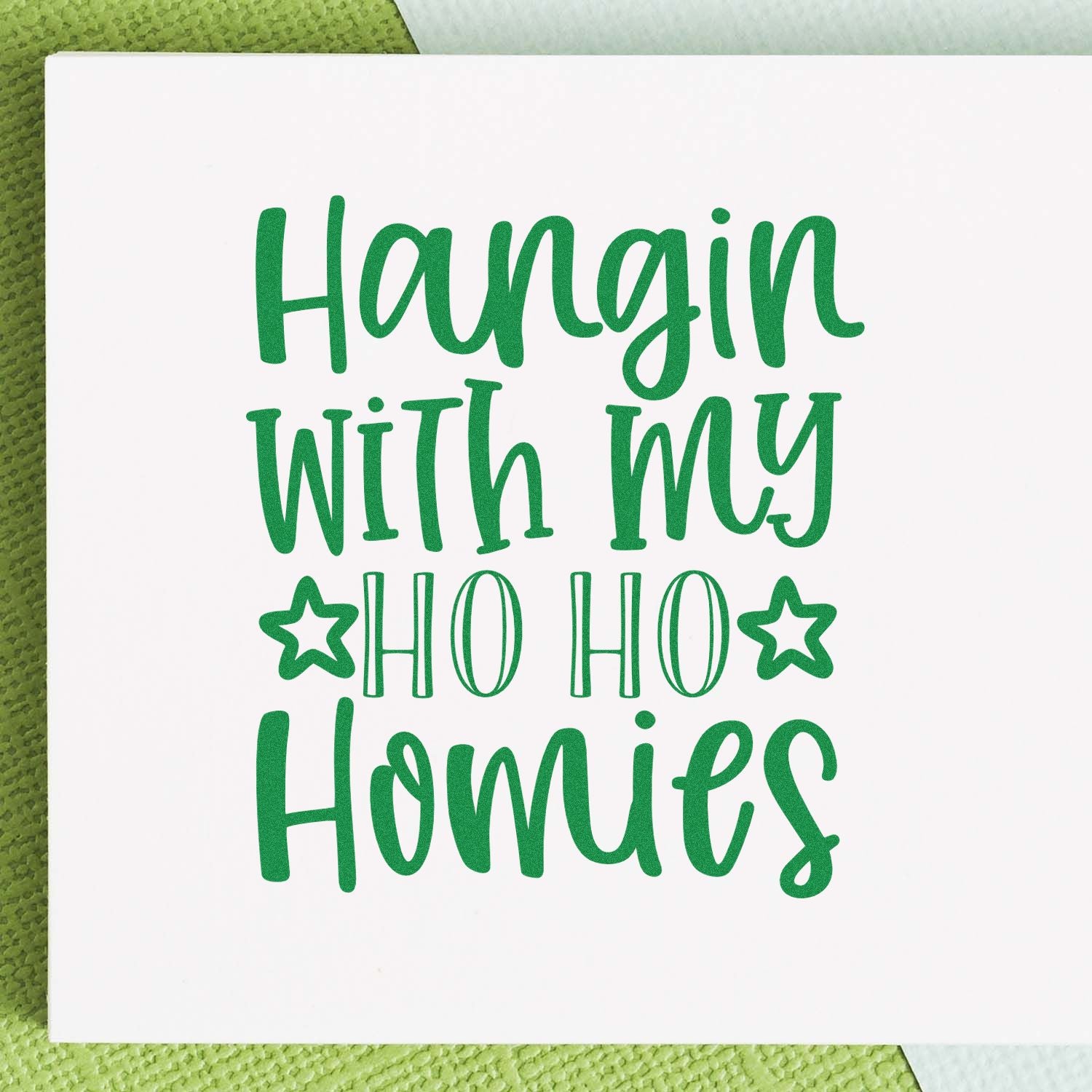 Christmas rubber stamp design with festive green lettering reading Hangin with my Ho Ho Homies for holiday crafting and cards.