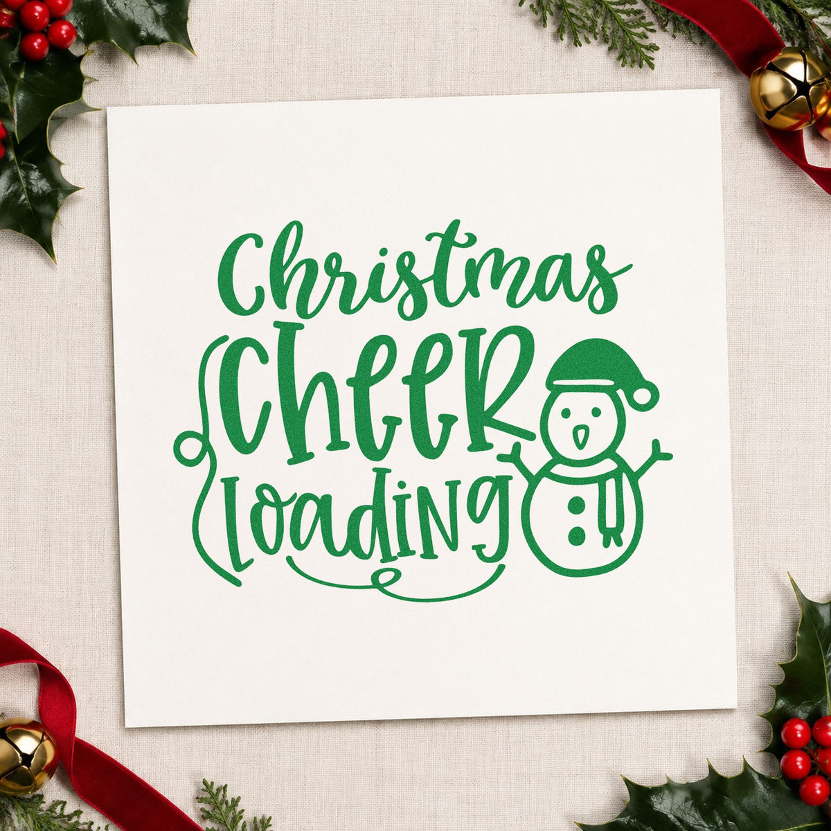 Christmas Cheer Loading Snowman craft stamp imprinted in green ink on paper, a design suited to framed play room.