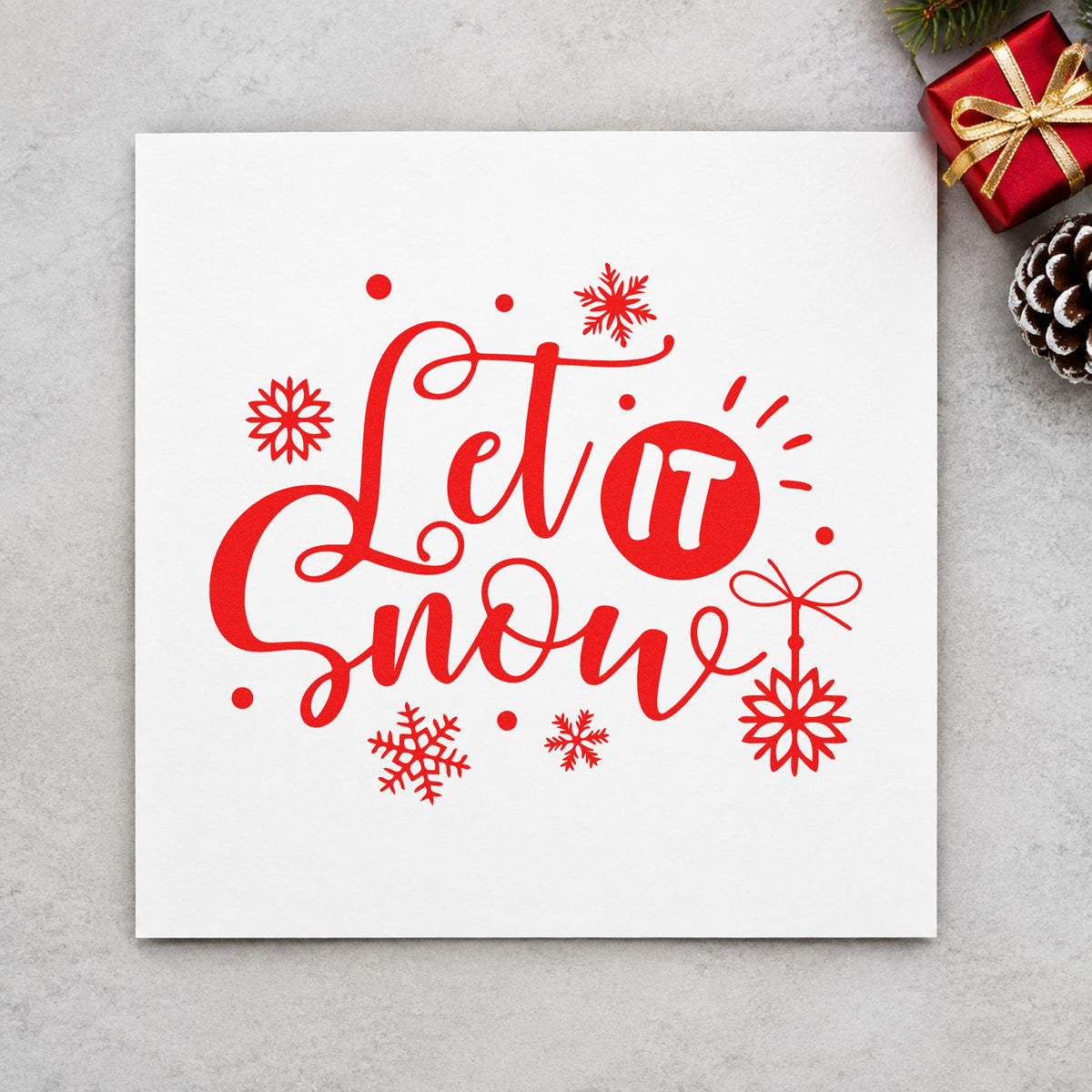 Let It Snow Ornaments rubber stamp shown in red ink, stamped for projects such as hook row labels.