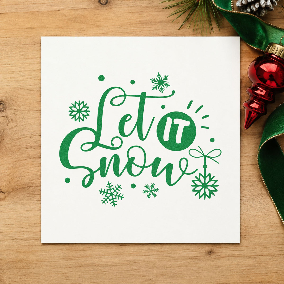 Let It Snow Ornaments craft stamp imprint in green ink on a handmade project, one idea being ceiling tag cards.