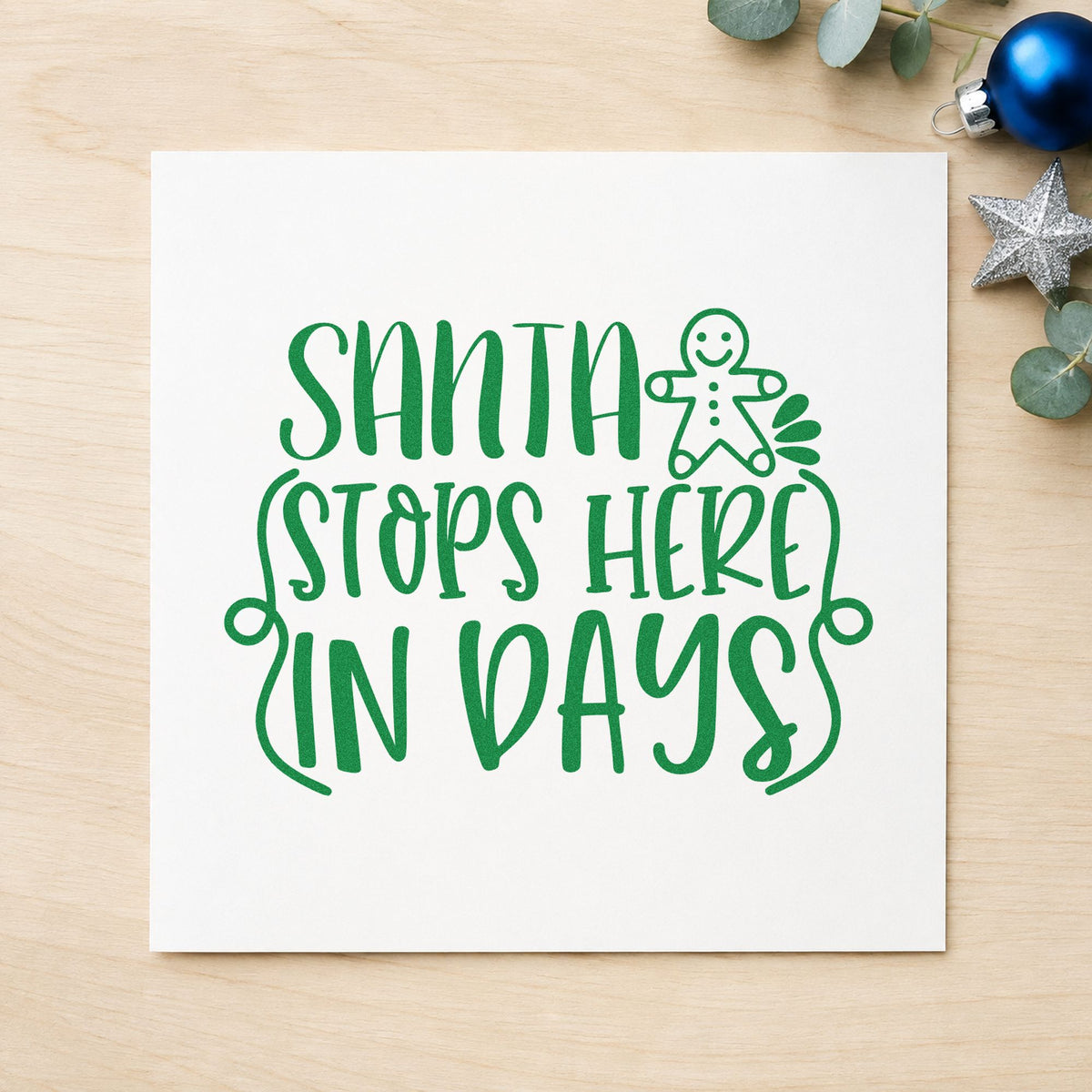 Santa Stops Here In Days craft stamp imprinted in green ink on paper, a design suited to framed slate middle.