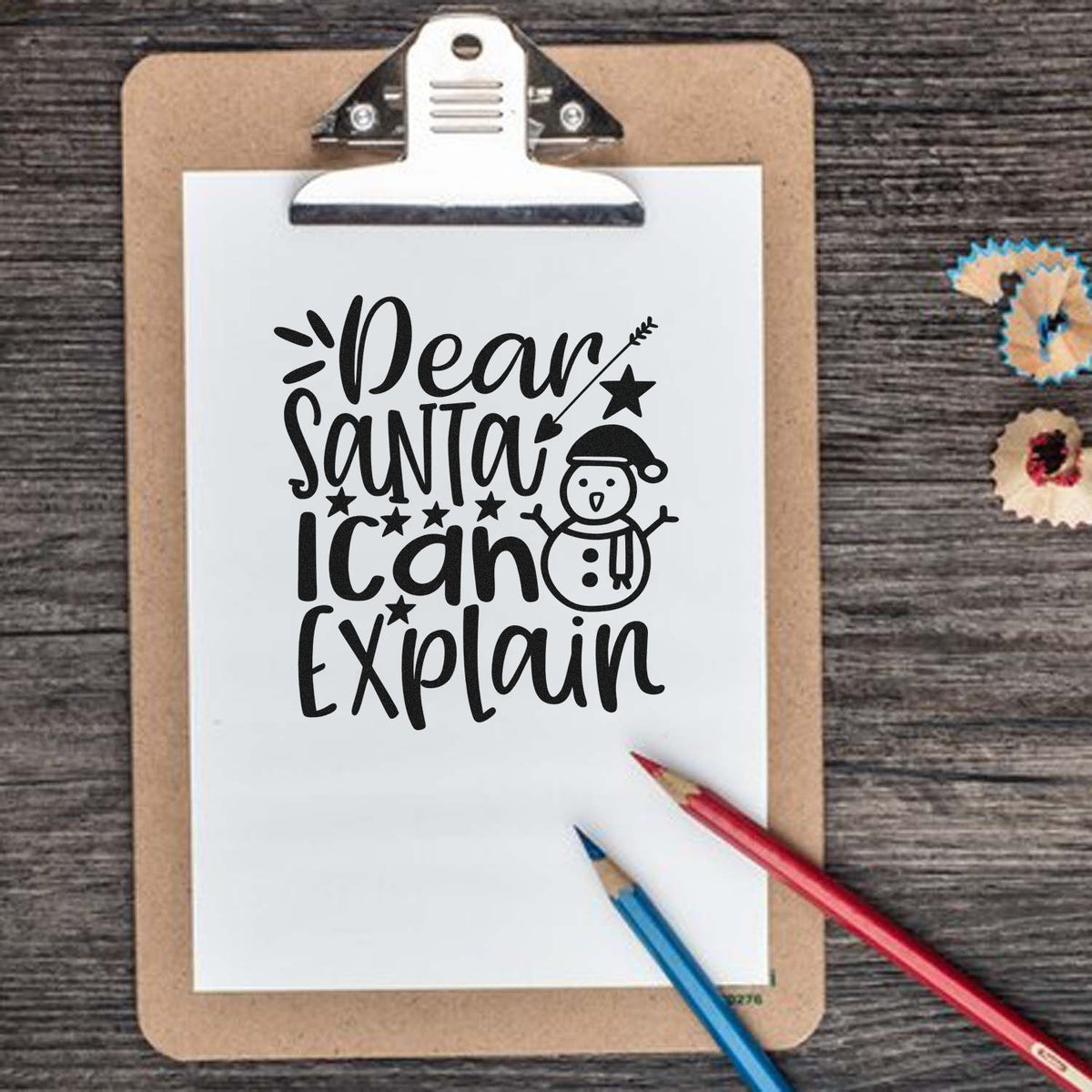 Vintage Pro Dear Santa I Can Explain Snowman Premium Wooden Stamp imprint stamped in black ink. The words "Dear Santa I can explain" include a snowman in a Santa hat, stars, and a heart-tipped arrow.