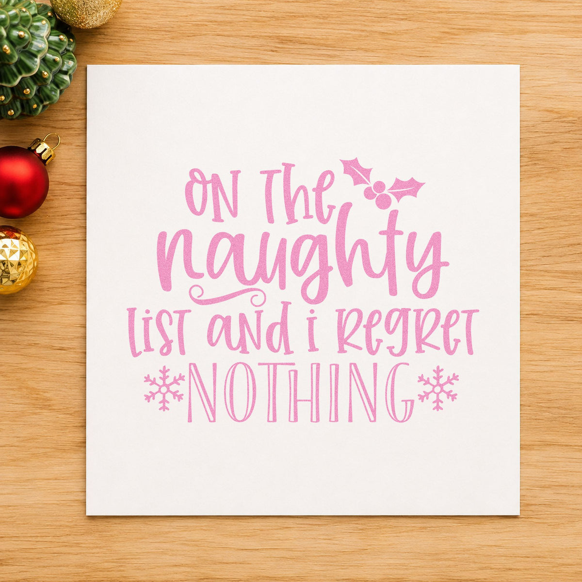 Naughty List Regret Nothing craft stamp in purple ink on cardstock, an easy option for no regrets album.