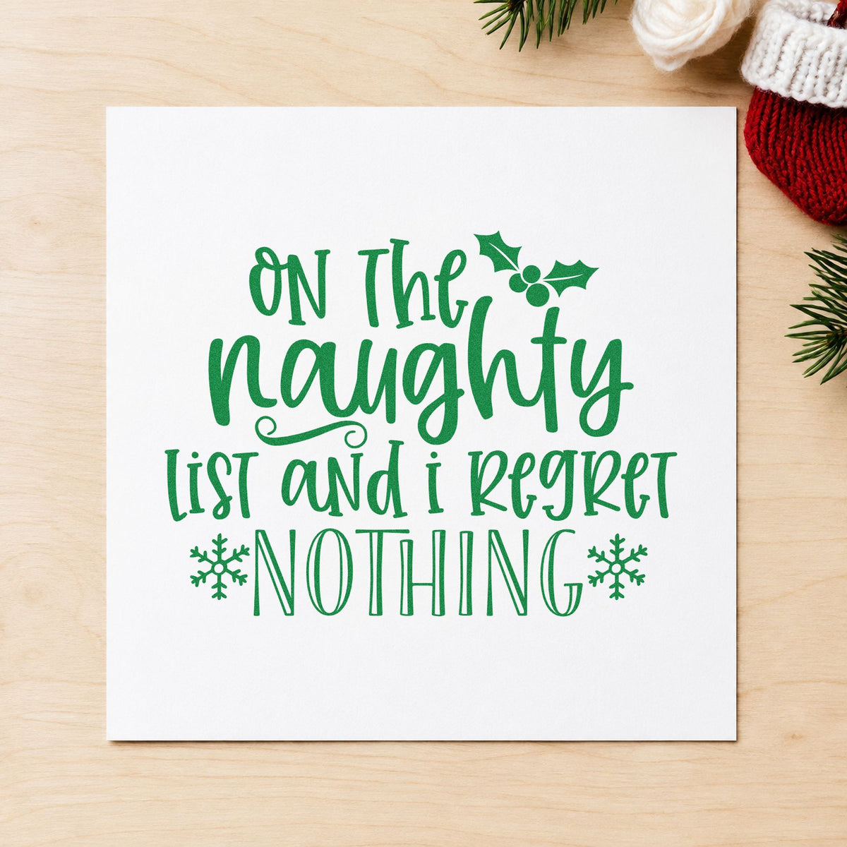 Naughty List Regret Nothing craft stamp imprint in green ink on a handmade project, one idea being bold choice tags.