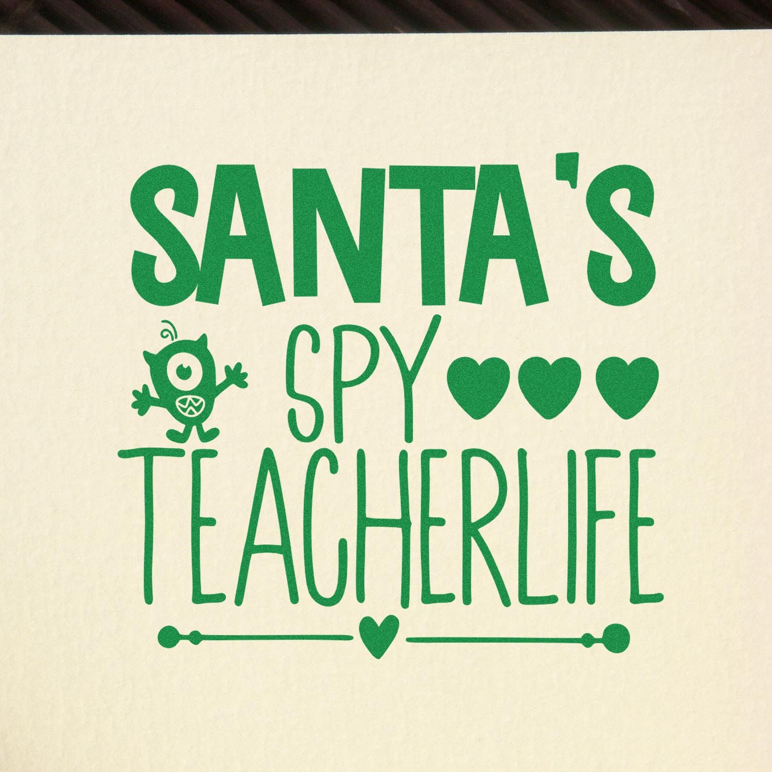 Santa's Spy Teacher Life rubber stamp design with Christmas hearts and monster icon for festive teacher crafts.
