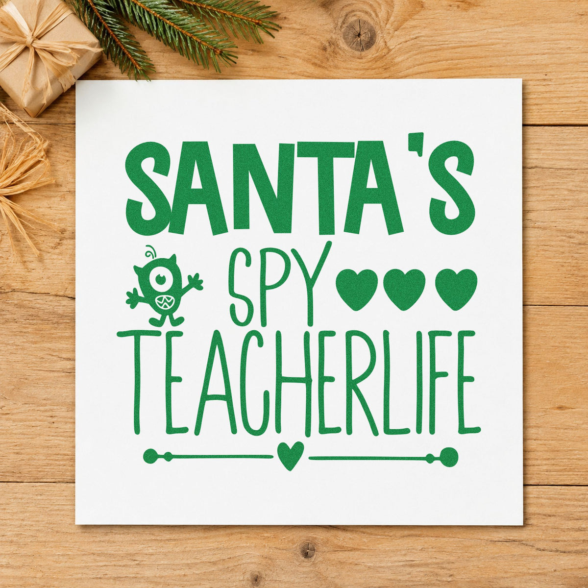 Santa's Spy Teacher Life craft stamp imprint in green ink on a handmade project, one idea being good day gift tags.