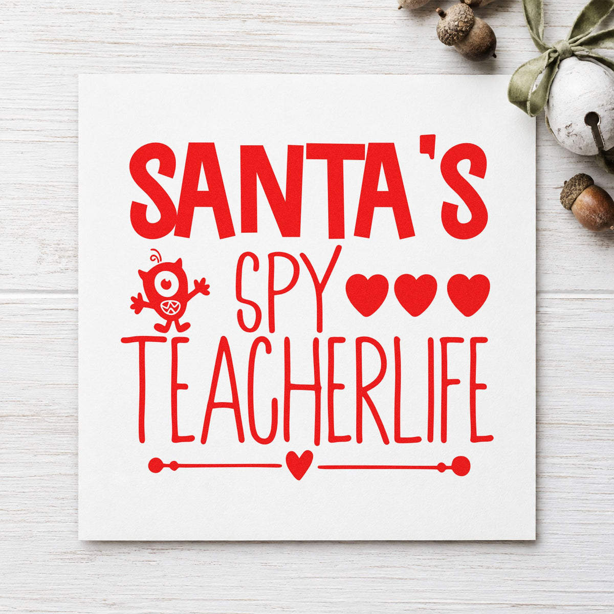 Santa's Spy Teacher Life craft stamp in red ink on cardstock, an easy option for lanyard strap printing.
