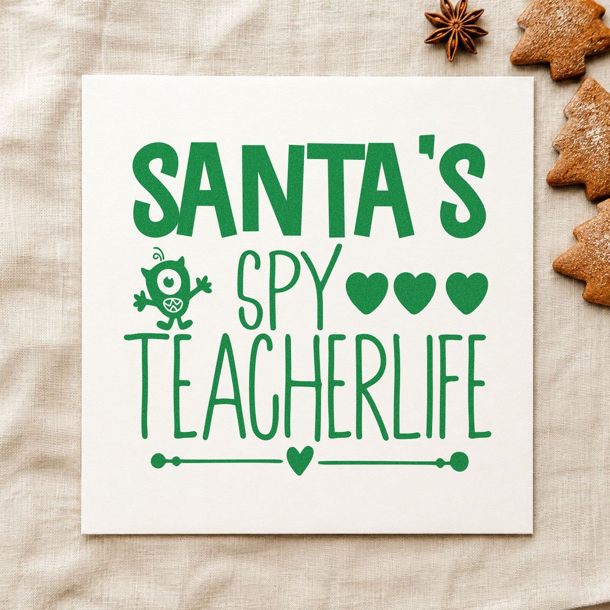 Santa's Spy Teacher Life craft stamp imprinted in green ink on paper, a design suited to framed board corner.