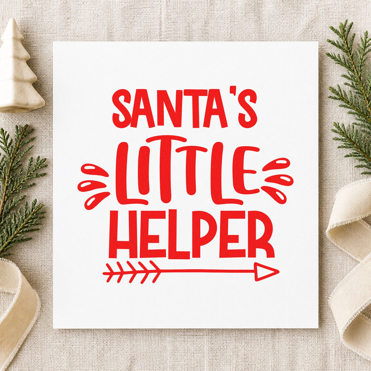 Santa's Little Helper Arrow craft stamp in red ink on cardstock, an easy option for apron hem printing.