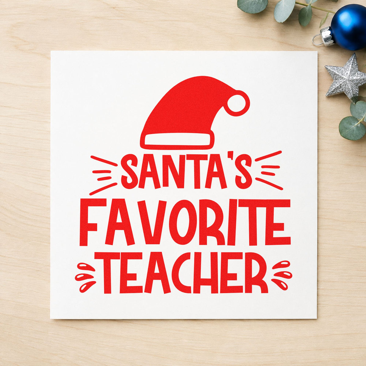 Santa's Favorite Teacher Hat craft stamp in red ink on cardstock, an easy option for lanyard ribbon ink.