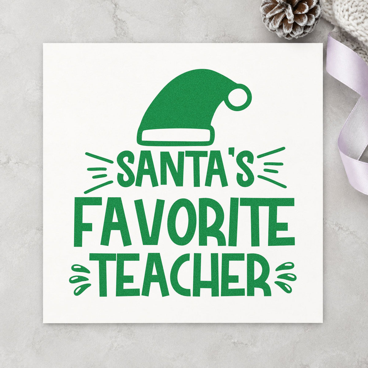 Santa's Favorite Teacher Hat craft stamp imprint in green ink on a handmade project, one idea being thank you cards.