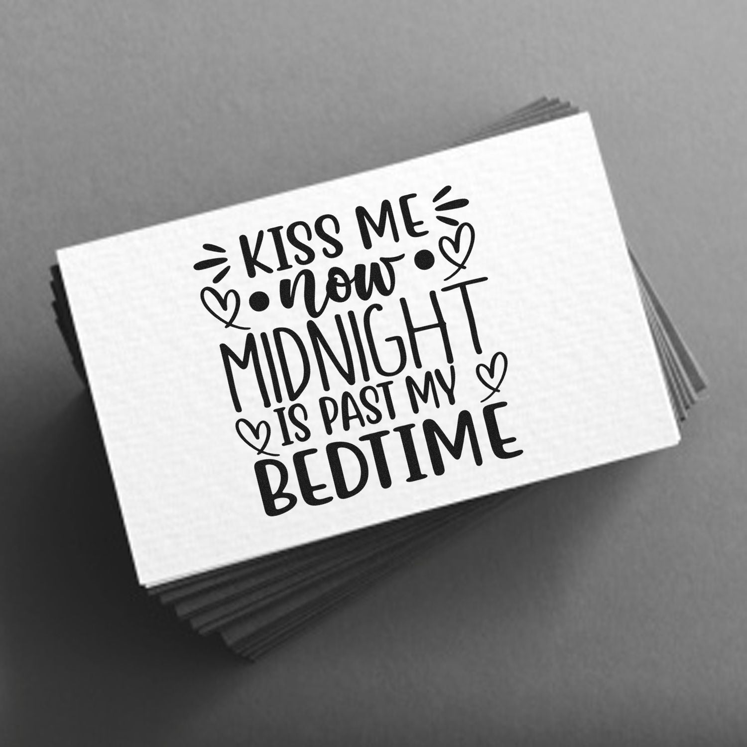 Romantic quote rubber stamp design reading Kiss Me Now, Midnight Is Past My Bedtime with heart accents.