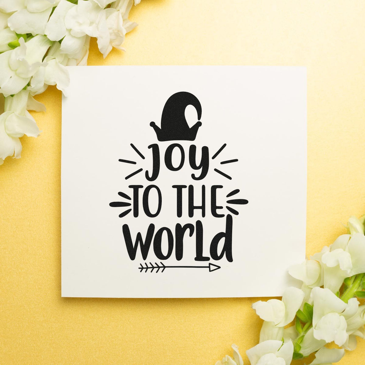 Vintage Pro Joy To The World Mitten Premium Wooden Stamp imprint stamped in black ink. The words "Joy to the world" appear beneath a mitten with accent lines and an arrow.