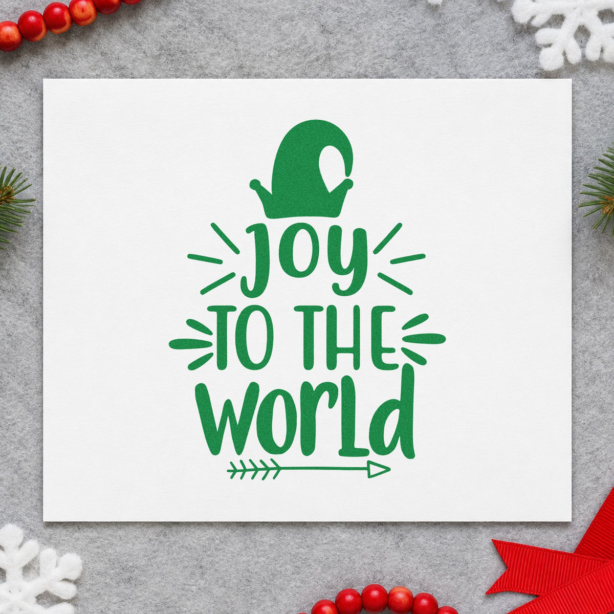 Joy To The World Mitten craft stamp imprint in green ink on a handmade project, one idea being mitten pair tags.