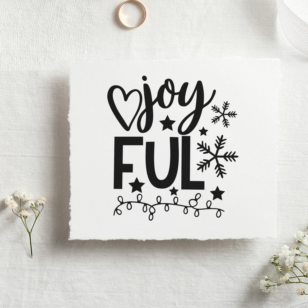 Premium Wooden Joyful Snowflakes And Lights With Stars Stamp - Vintage Pro imprint stamped in black ink. The word "joyful" is split between script and block letters with a heart, stars, snowflakes, and string lights.