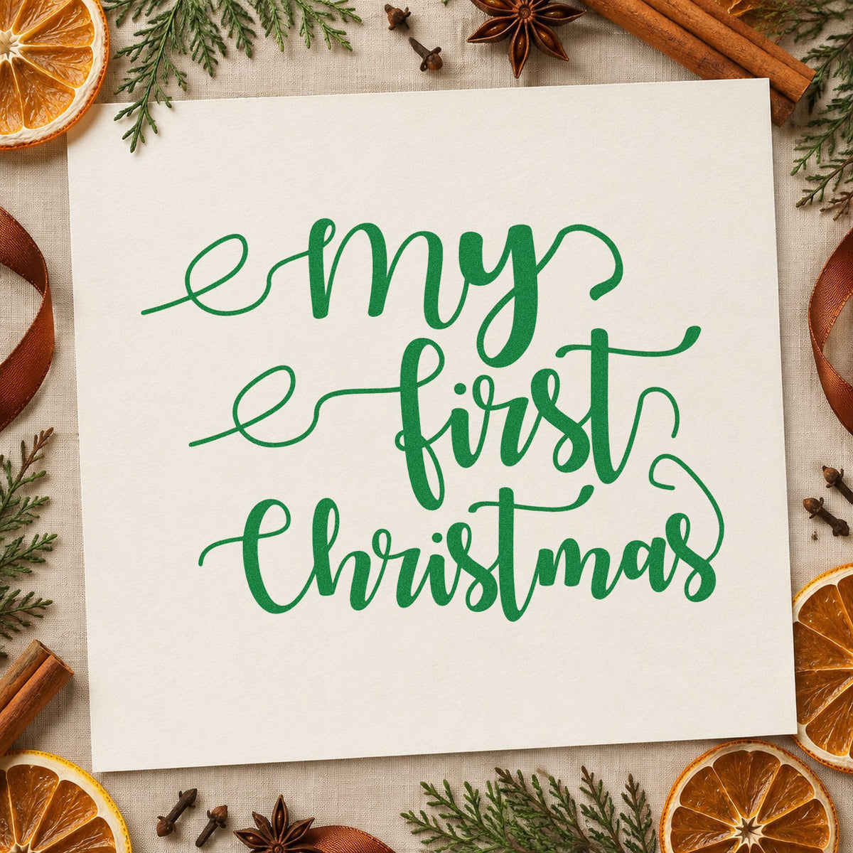 My First Christmas Script craft stamp imprint in green ink on a handmade project, one idea being silk ribbon tags.