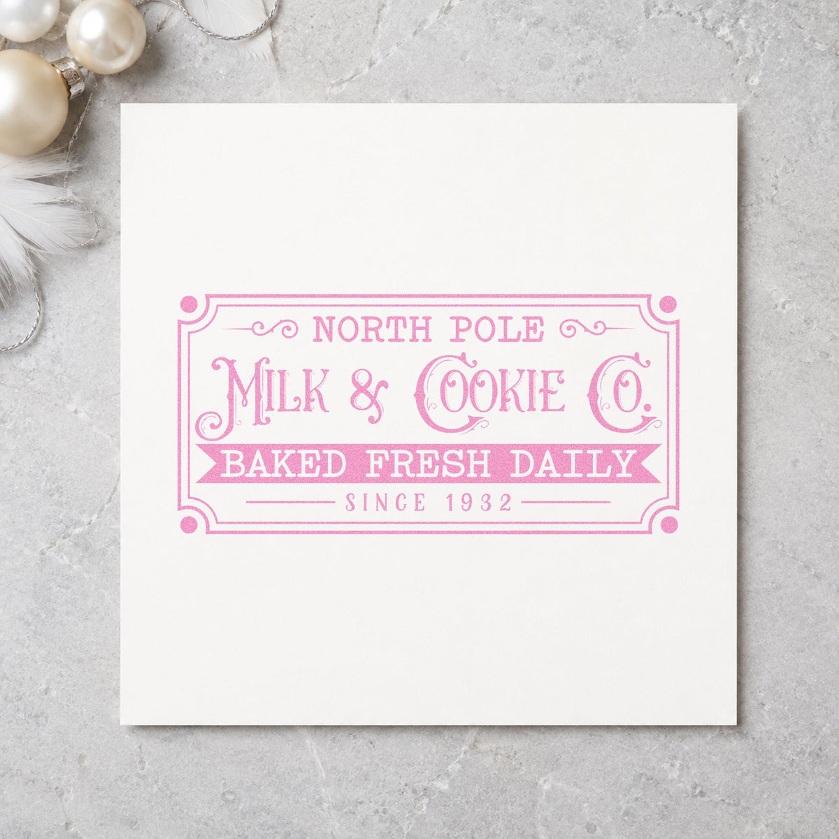 North Pole Milk Cookie Company craft stamp in purple ink on cardstock, an easy option for dairy route album.