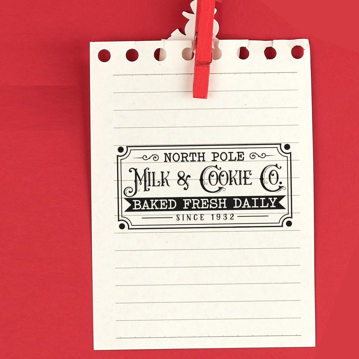 North Pole Milk Cookie Company Frame Accent Stamp - Premium Vintage Pro Wooden imprint stamped in black ink. A rectangular vintage sign reads "North Pole Milk & Cookie Co.," "baked fresh daily," and "since 1932."