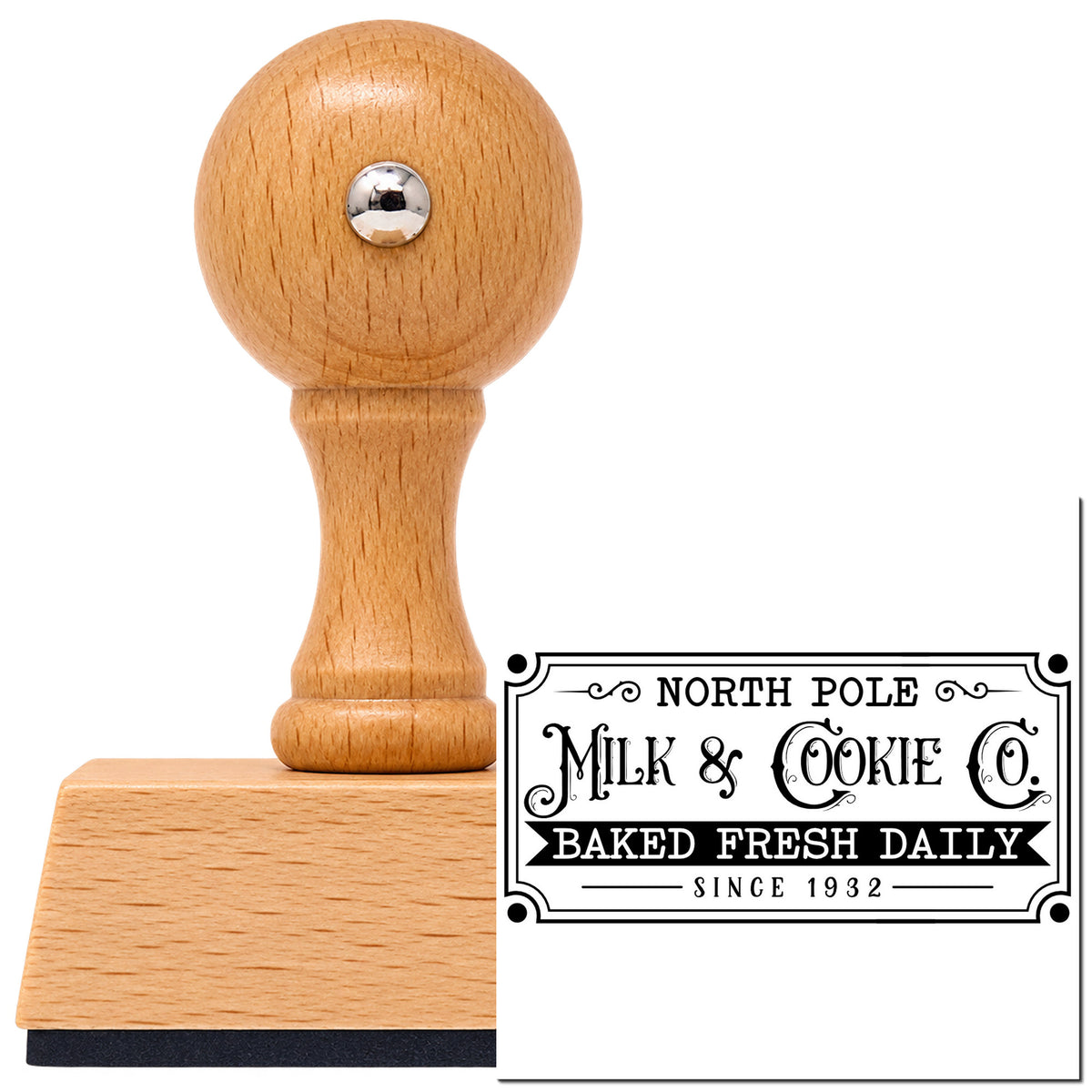 North Pole Milk Cookie Company Frame Accent Vintage Pro rubber stamp in European beech wood with a round knob handle, shown beside its black imprint.