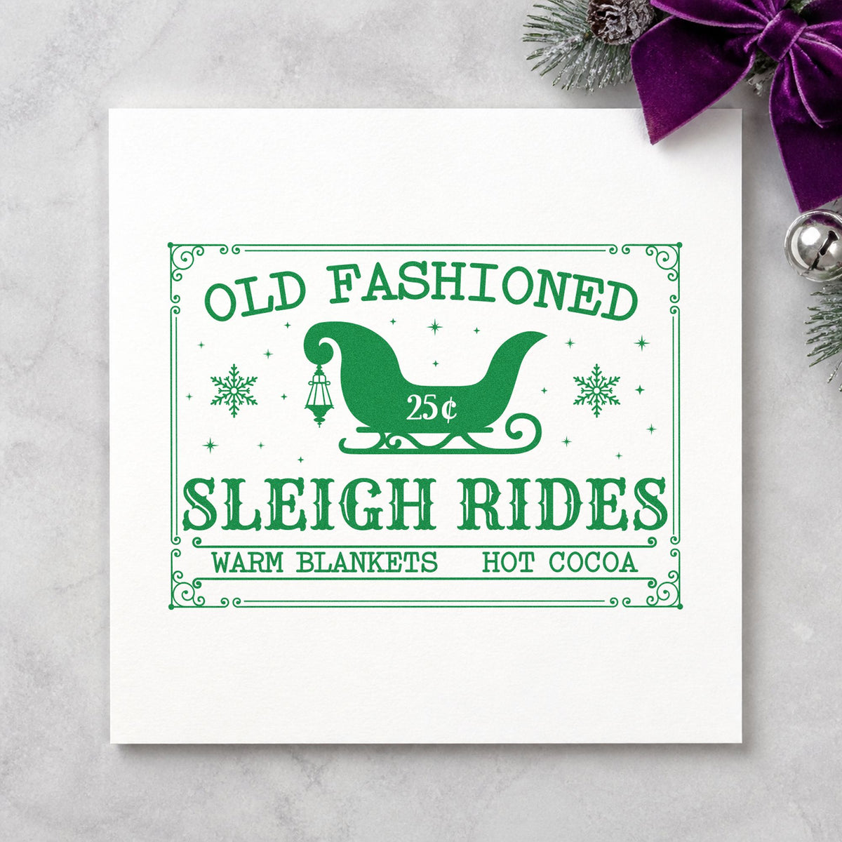 Old Fashioned Sleigh Rides craft stamp imprint in green ink on a handmade project, one idea being ride ticket slips.