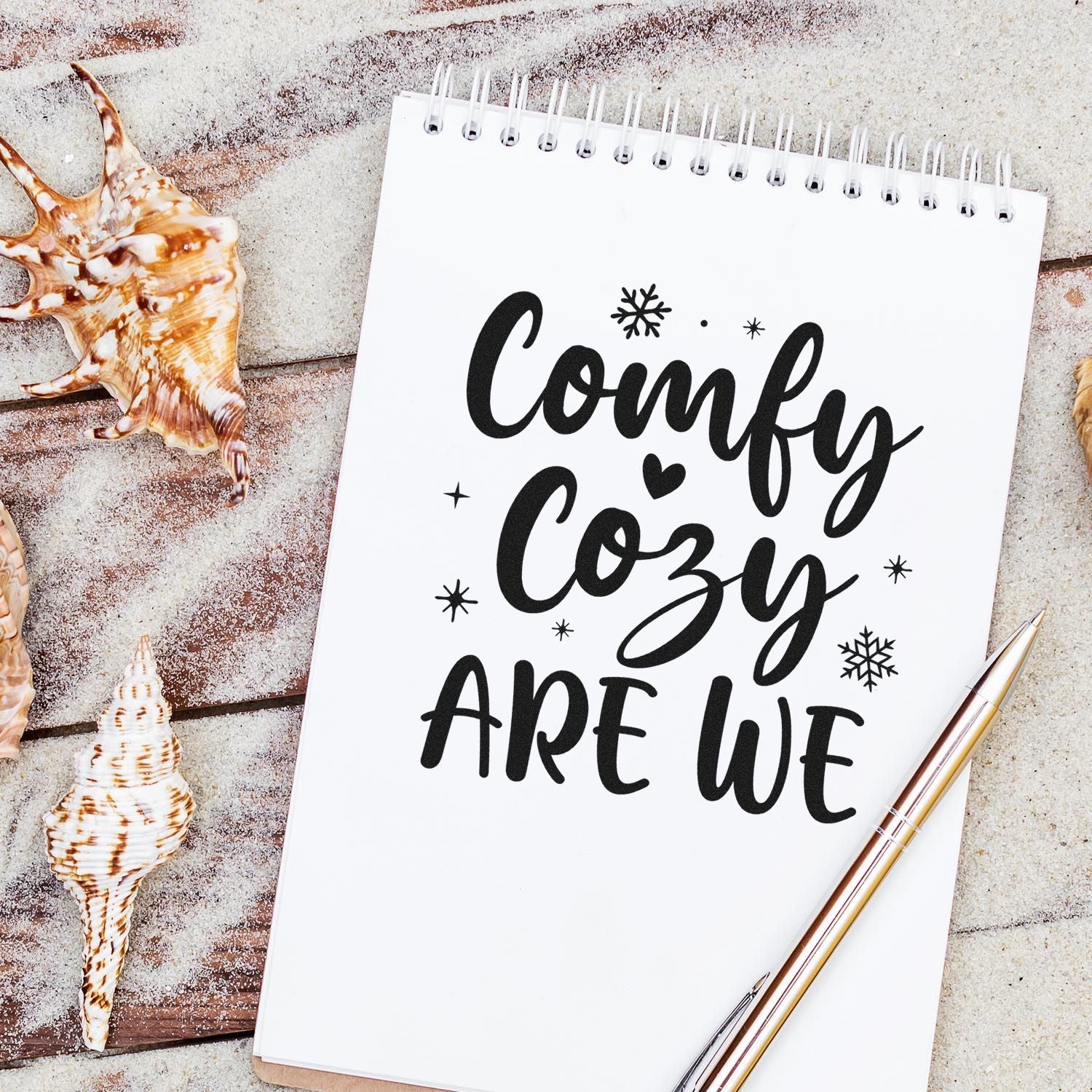 Comfy Cozy Are We rubber stamp design on a notebook, perfect for winter craft projects, journaling, and cozy handmade decor.
