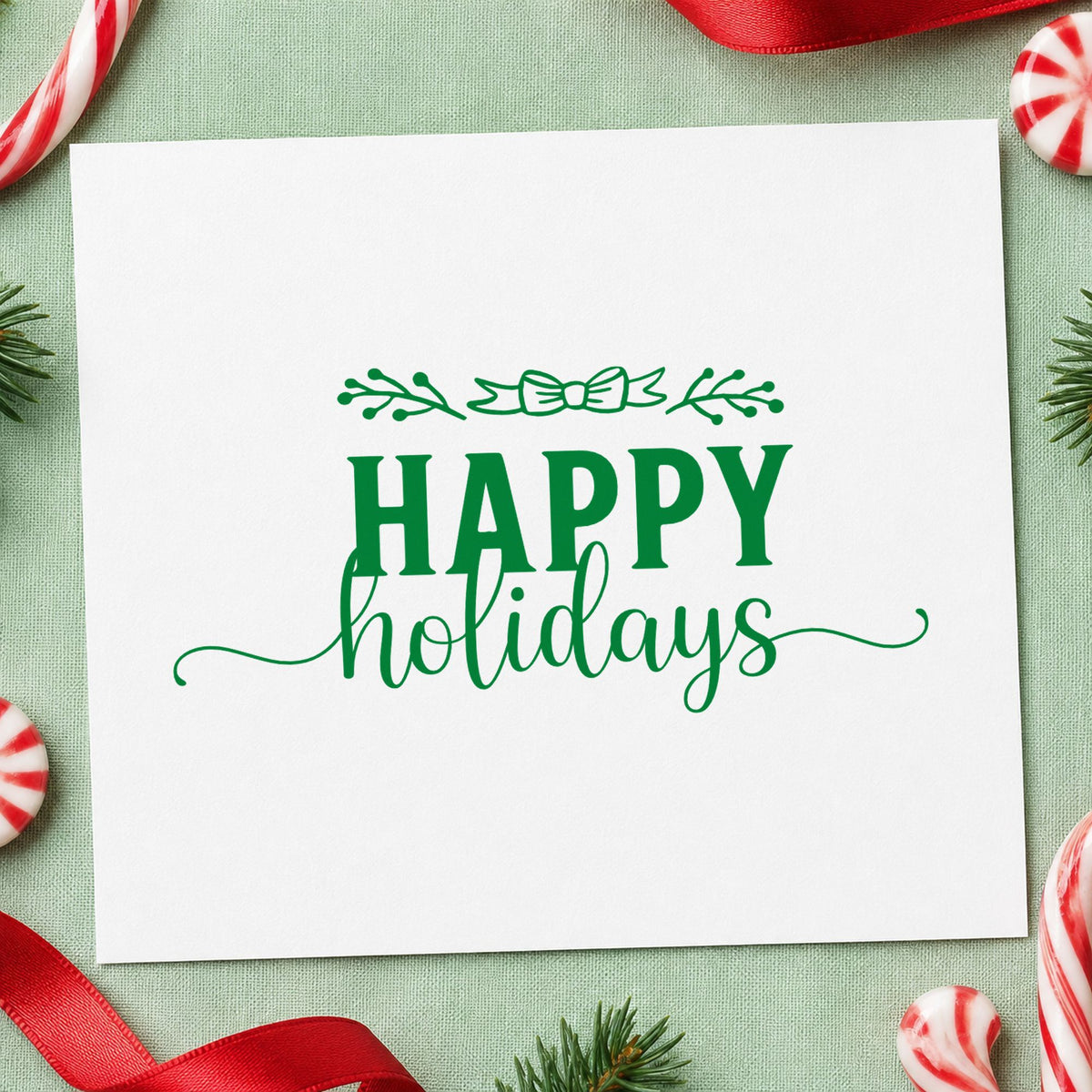 Happy Holidays Leafy Flourish craft stamp imprint in green ink on a handmade project, one idea being banded gift tags.