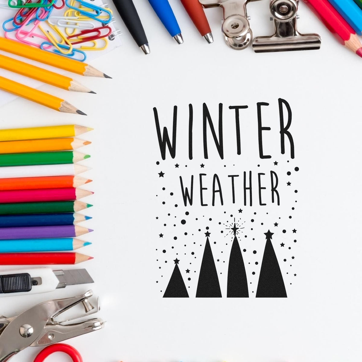 Winter Weather Four Trees Premium Wood-Mounted Stamp - Vintage Pro imprint stamped in black ink. The words "Winter weather" appear above four triangular trees amid falling snow dots.