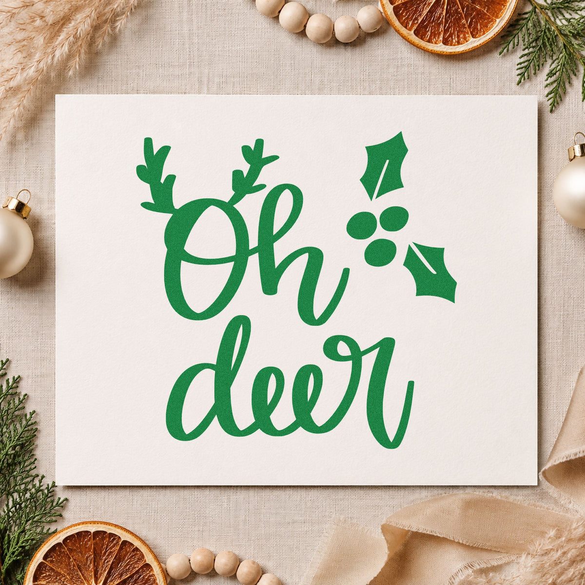 Oh Deer Antlers Holly craft stamp imprint in green ink on a handmade project, one idea being quick gift tags.