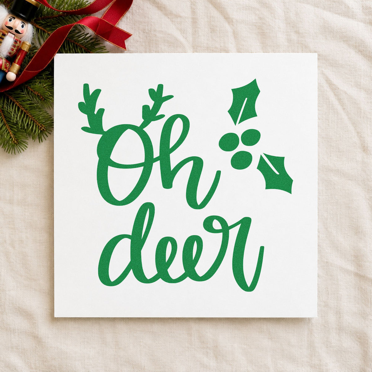 Oh Deer Antlers Holly craft stamp imprinted in green ink on paper, a design suited to framed small ledge.