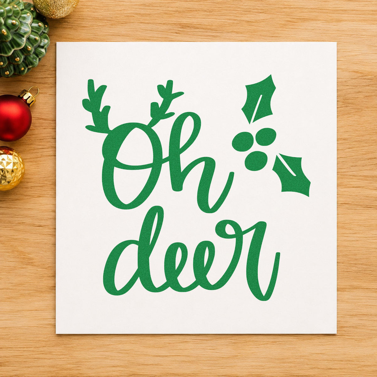 Oh Deer Antlers Holly craft stamp imprint in green ink on a handmade project, one idea being place marker cards.