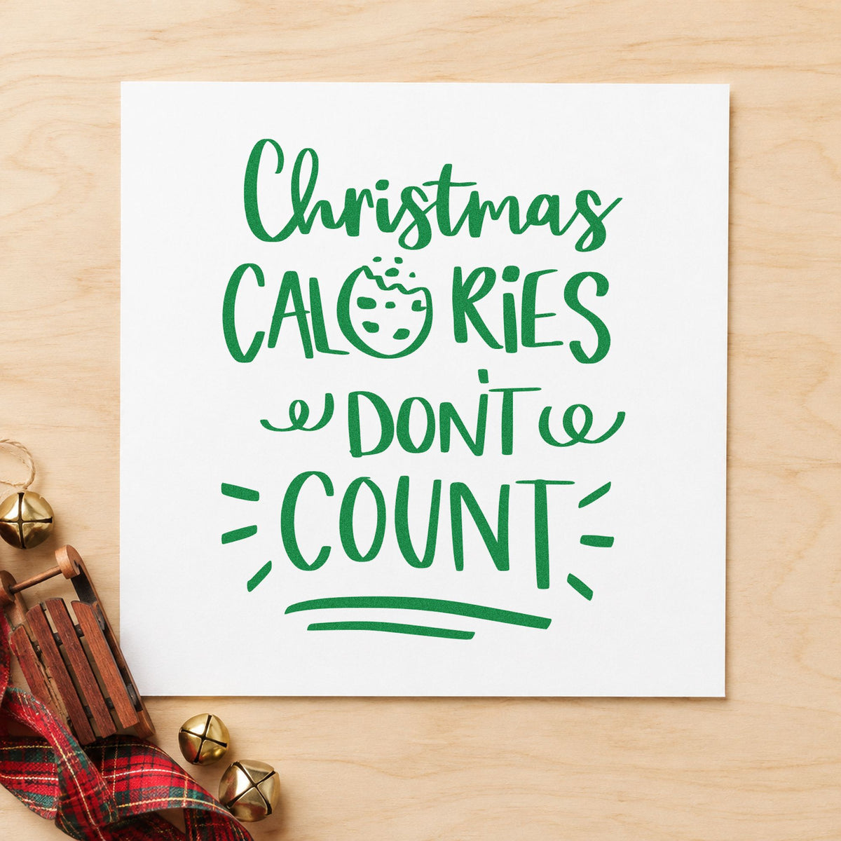 Christmas Calories Don't Count craft stamp imprinted in green ink on paper, a design suited to framed order window.