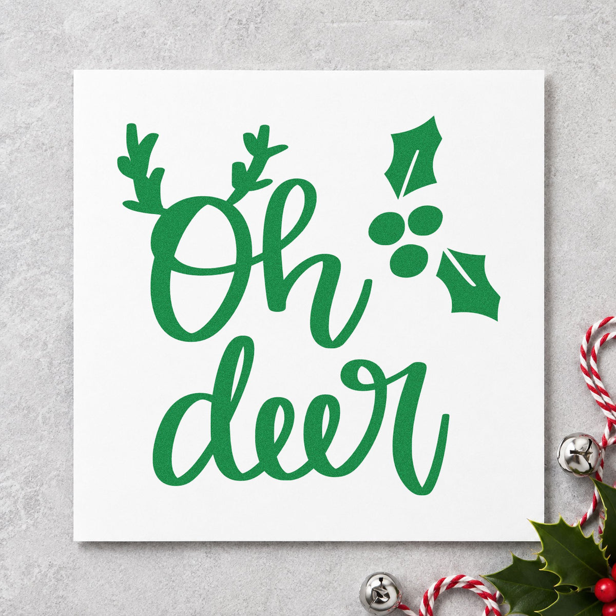 Oh Deer Holly Antlers craft stamp imprinted in green ink on paper, a design suited to framed shed wall.