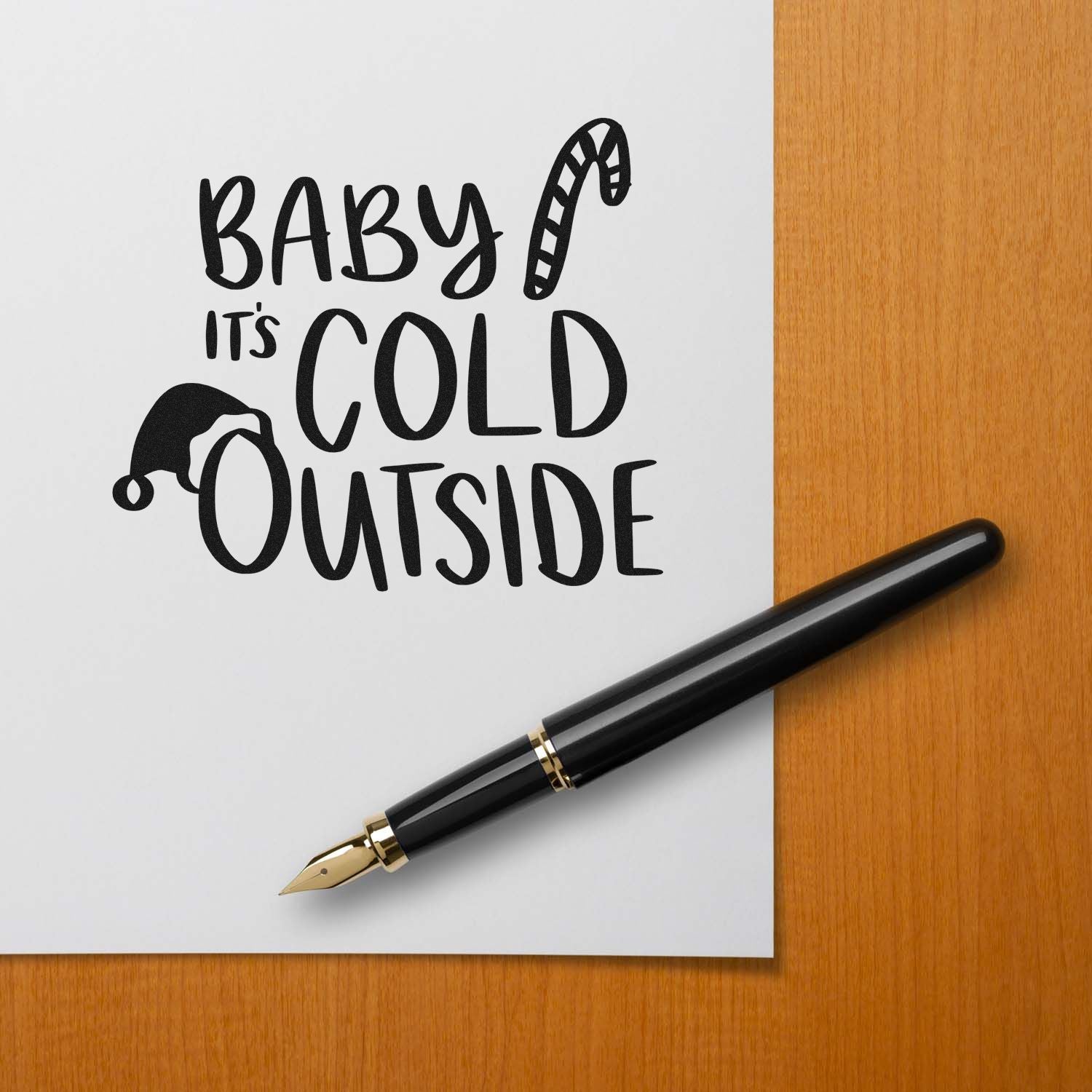 Baby its cold outside holiday rubber stamp design with Santa hat and candy cane, perfect for winter card making.
