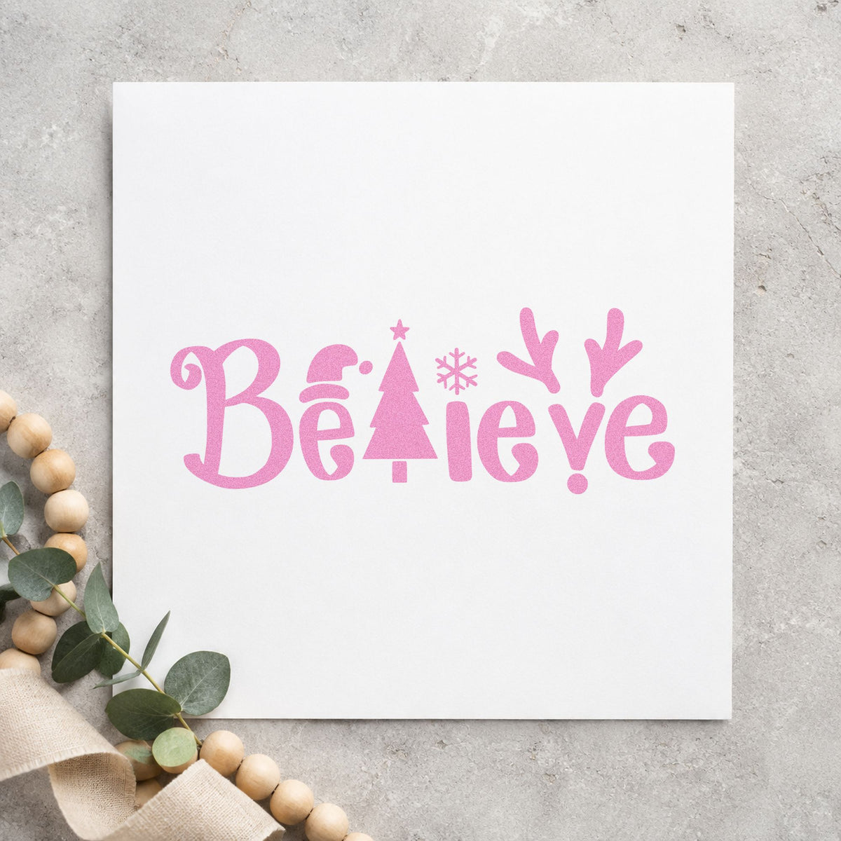 Believe Holiday Lettering Icons craft stamp in purple ink on cardstock, an easy option for lettering album page.