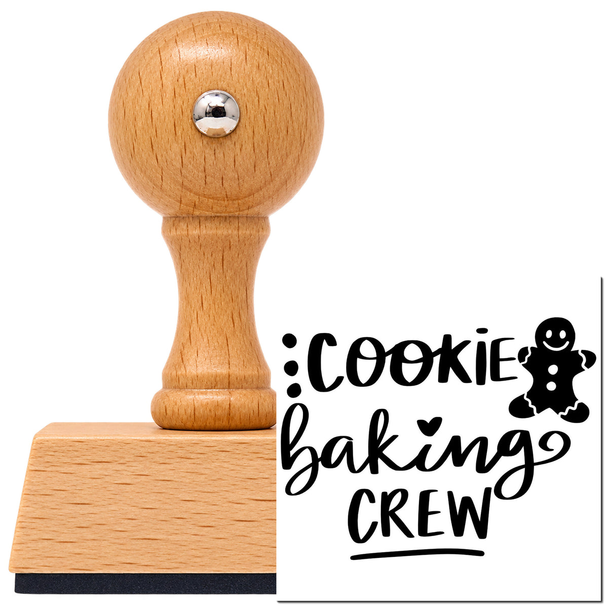 Cookie Baking Crew Gingerbread Lettering Vintage Pro rubber stamp in European beech wood with a round knob handle, shown beside its black imprint.