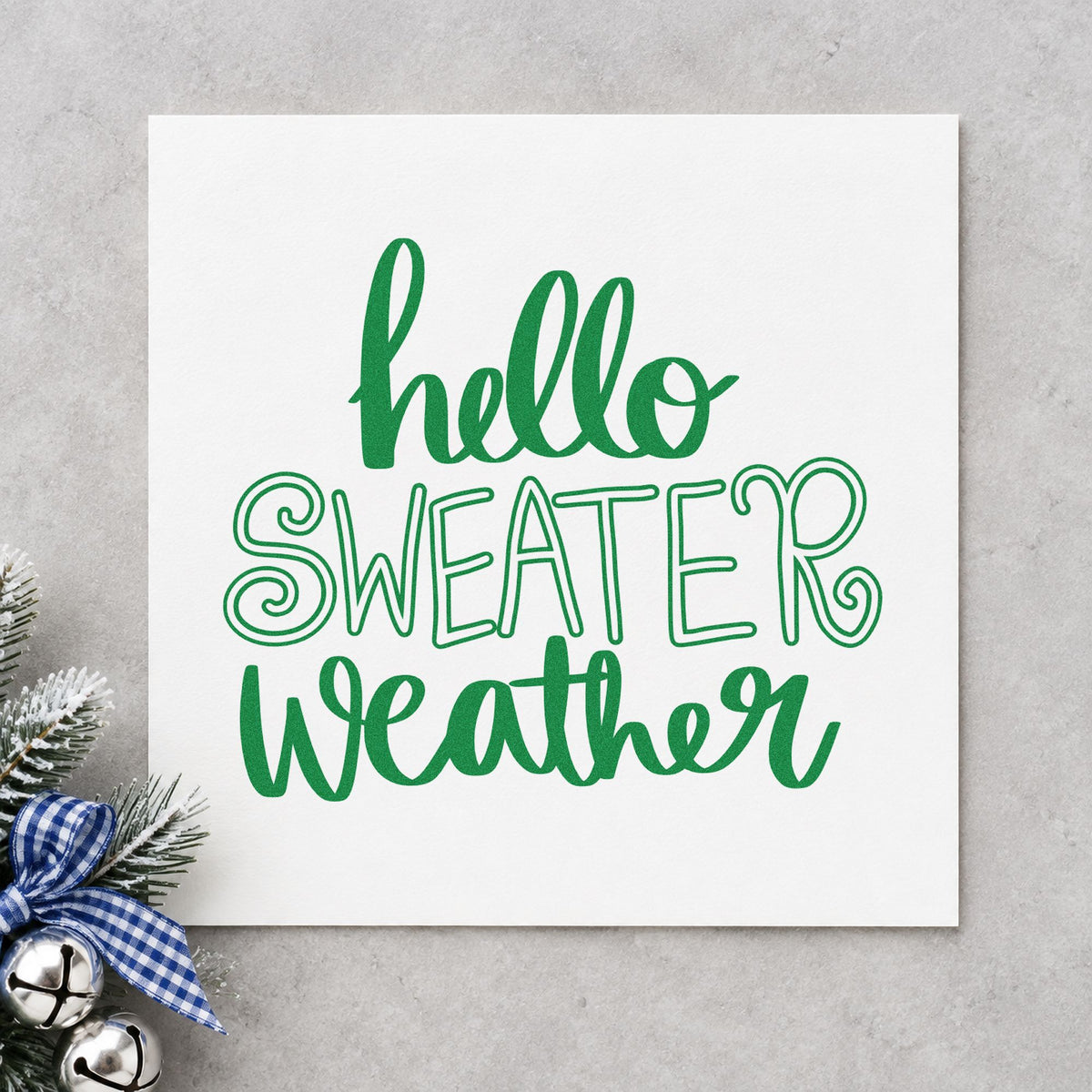 Hello Sweater Weather Lettering craft stamp imprint in green ink on a handmade project, one idea being hollow letter tags.