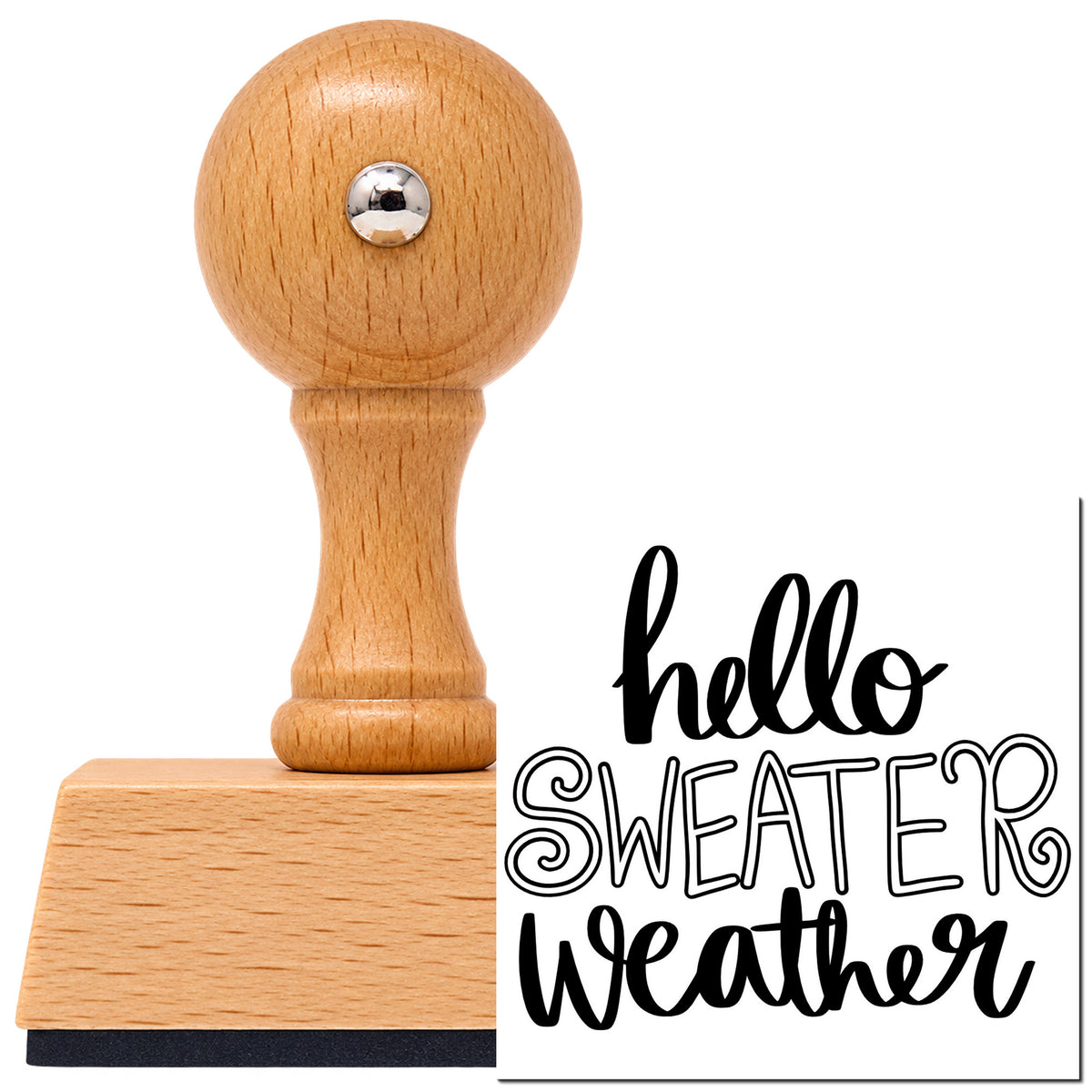 Hello Sweater Weather Lettering Vintage Pro rubber stamp in European beech wood with a round knob handle, shown beside its black imprint.