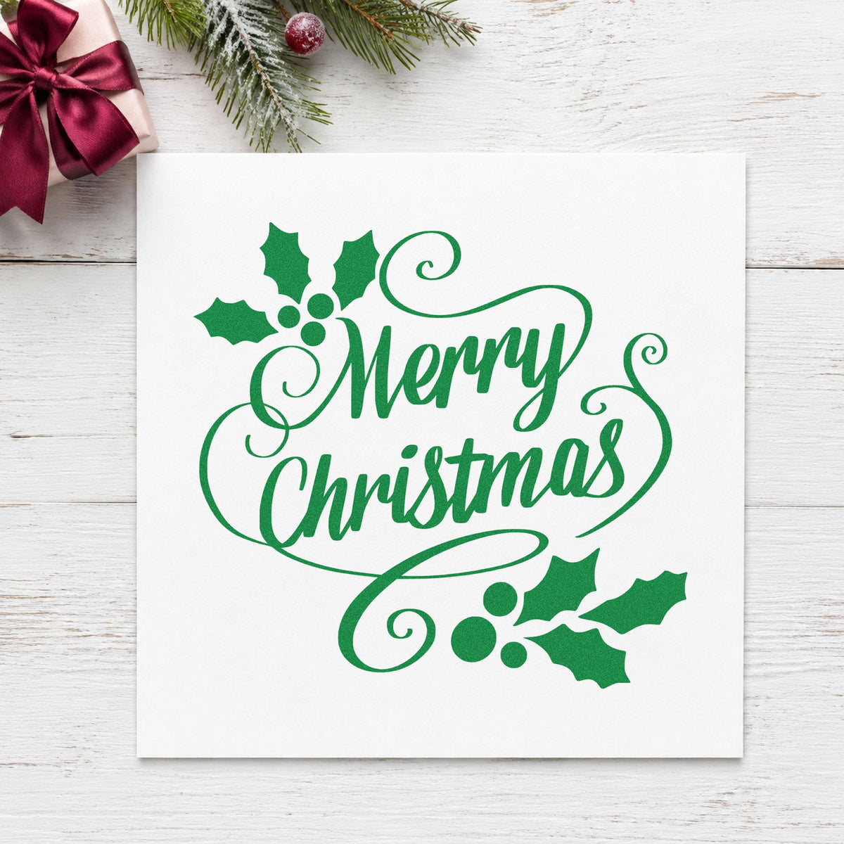 Merry Christmas Holly Flourishes craft stamp imprint in green ink on a handmade project, one idea being dinner program cards.