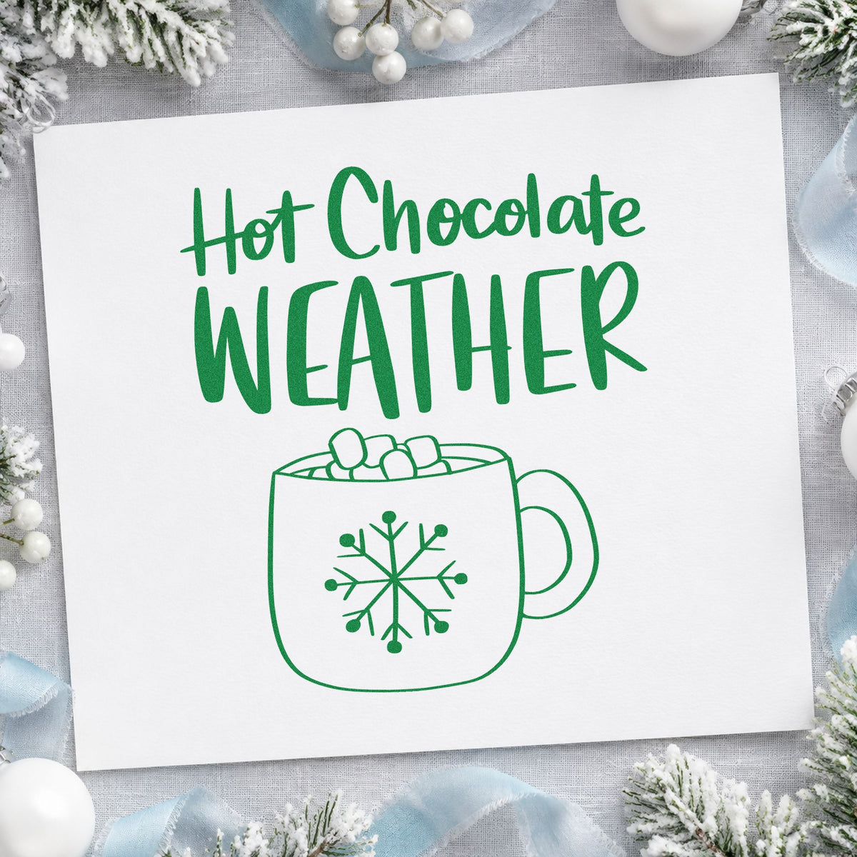 Hot Chocolate Weather Mug craft stamp imprinted in green ink on paper, a design suited to framed cocoa nook.