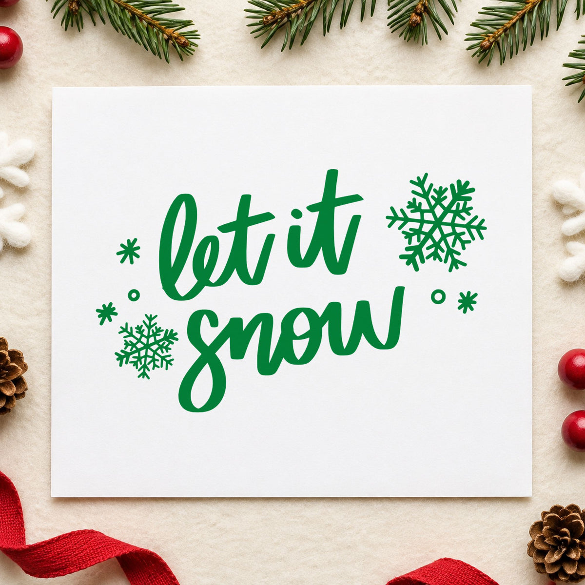 Let It Snow Script Snowflakes craft stamp imprint in green ink on a handmade project, one idea being place card slips.