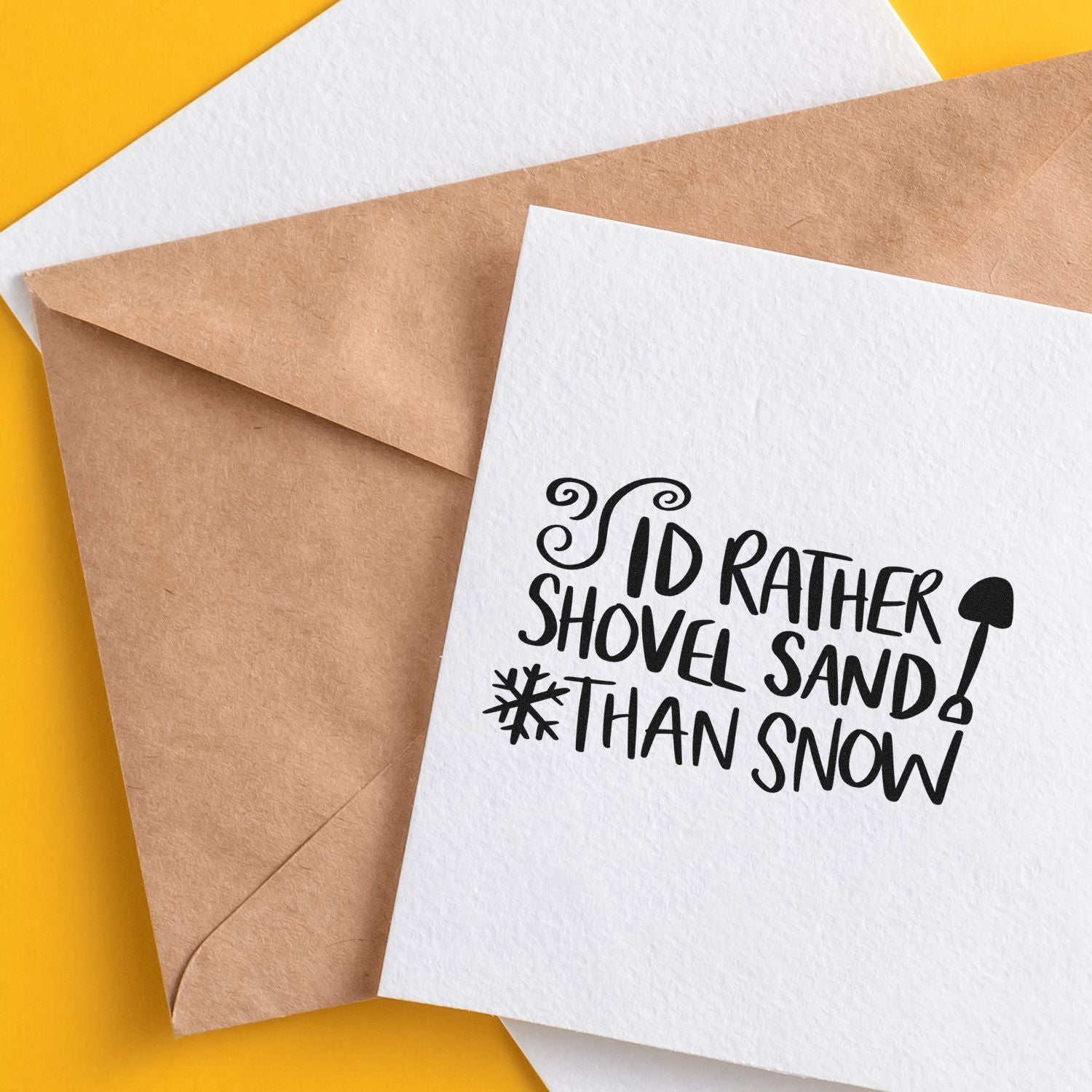 Beach-themed rubber stamp greeting card reading Id rather shovel sand than snow for winter and holiday crafting.