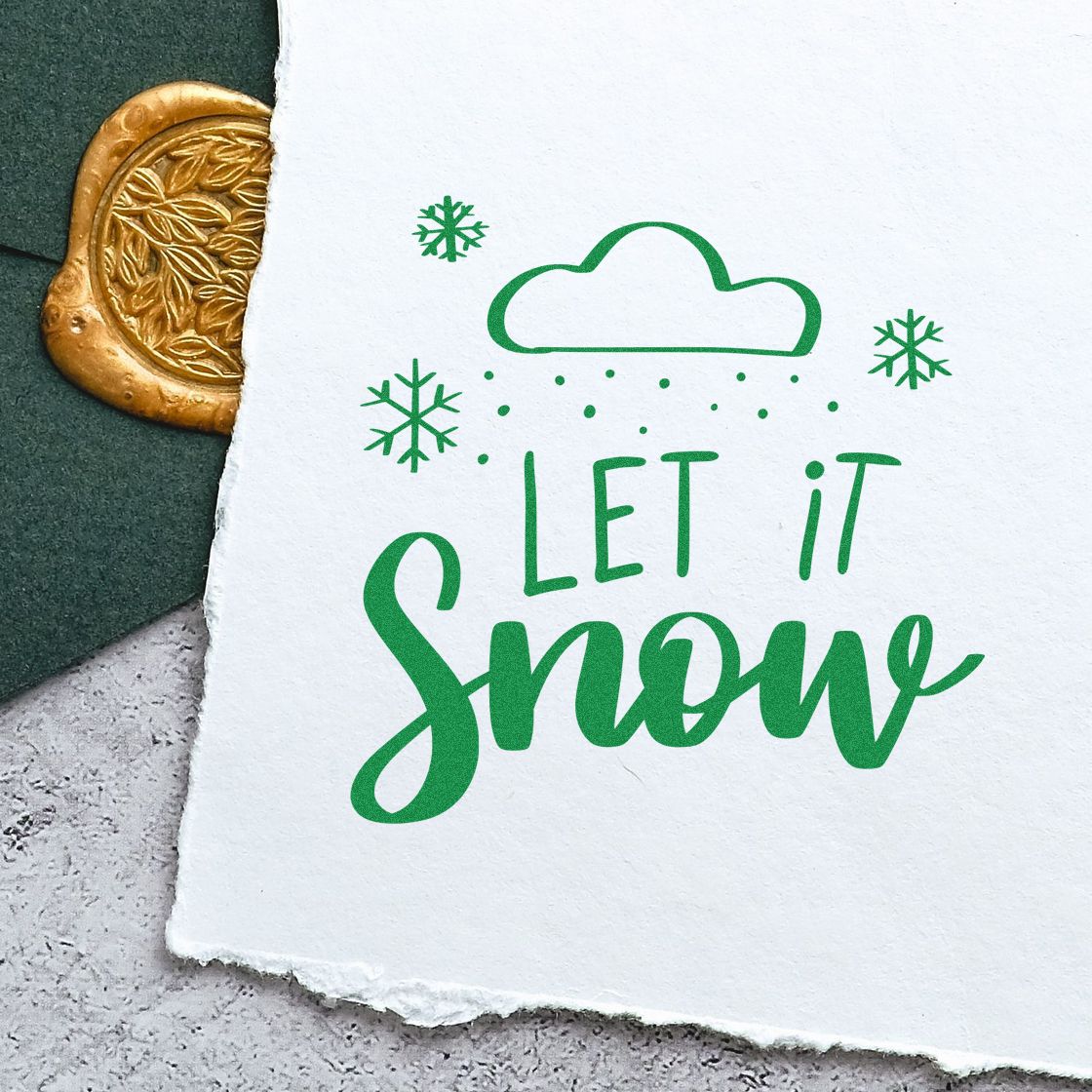 Let It Snow Cloud rubber stamp shown in green ink, stamped for projects such as forecast album page.