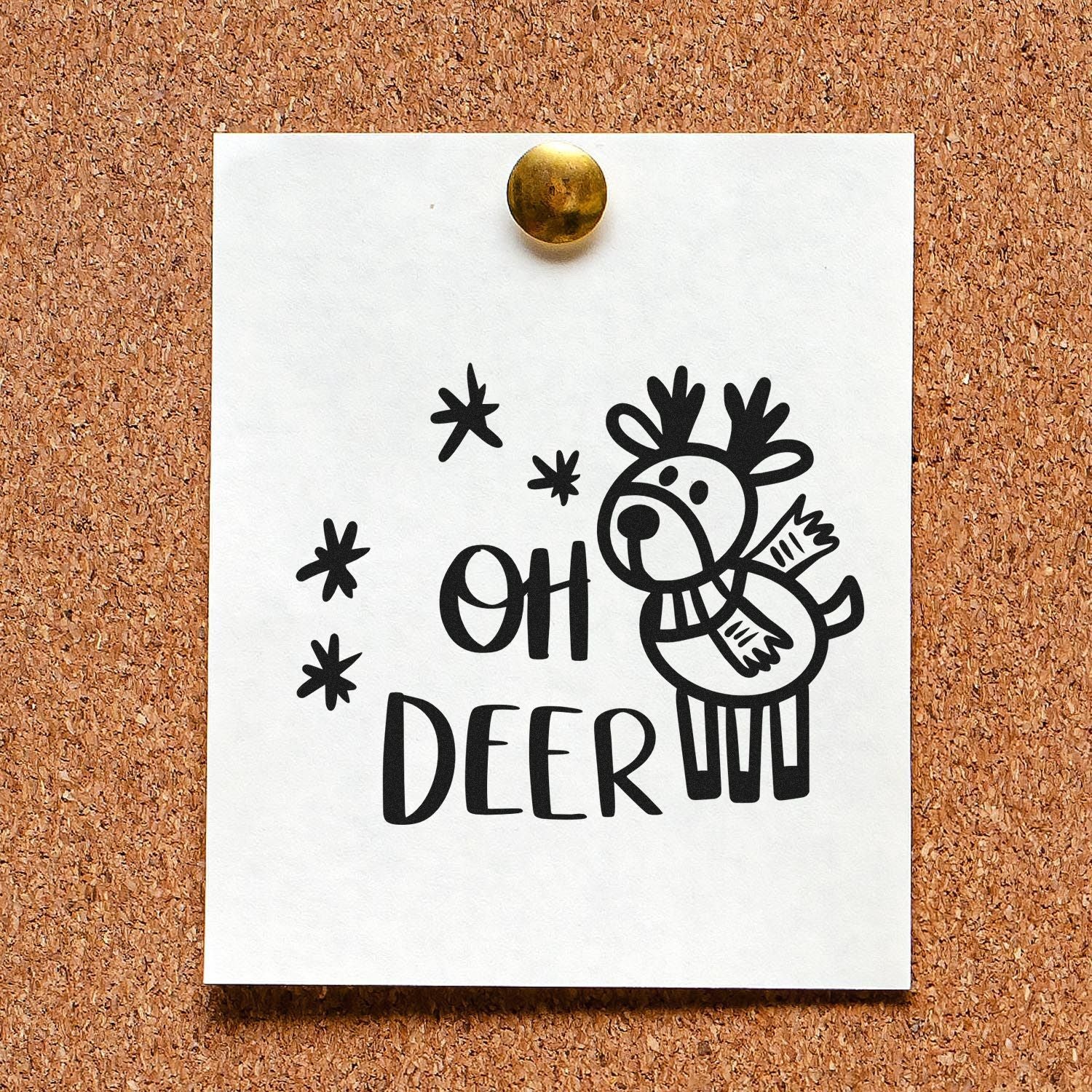 Oh Deer rubber stamp design with playful deer illustration on paper pinned to a corkboard.