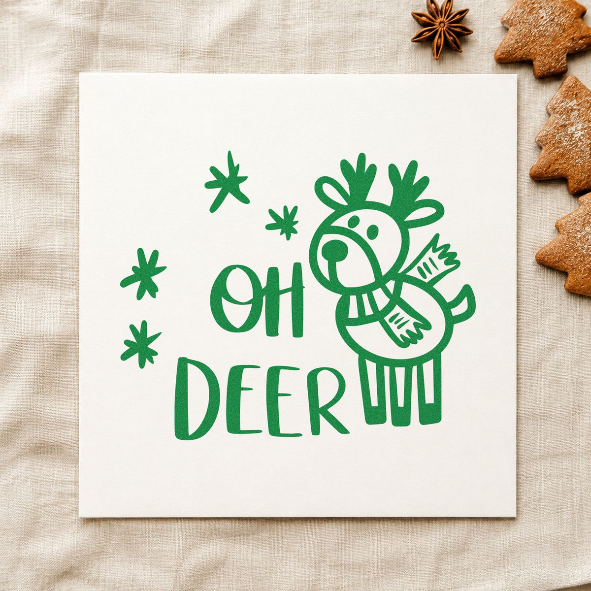 Oh Deer Cartoon Reindeer craft stamp imprint in green ink on a handmade project, one idea being plush toy gift tags.