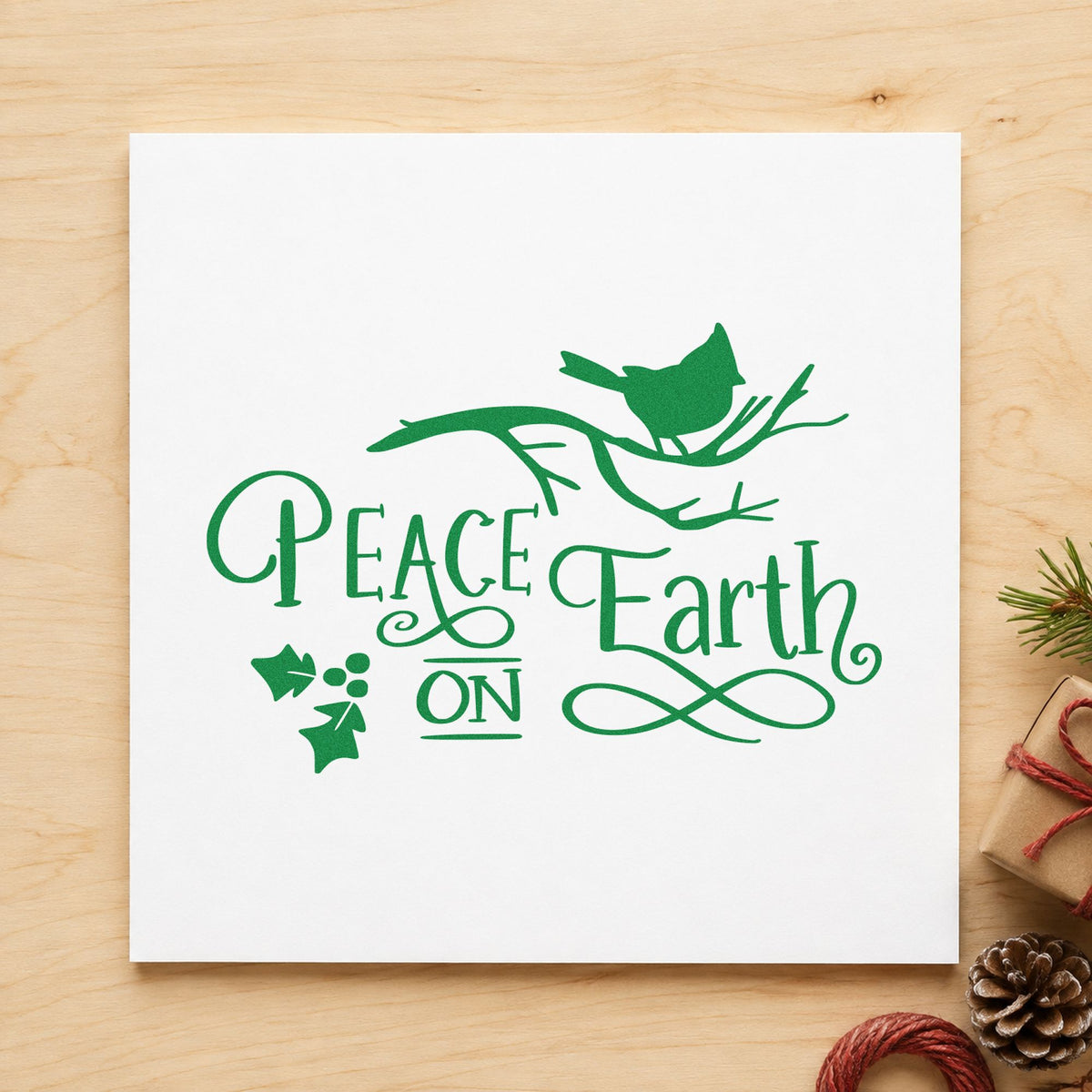 Peace On Earth Bird Branch craft stamp imprint in green ink on a handmade project, one idea being birdseed bag tags.