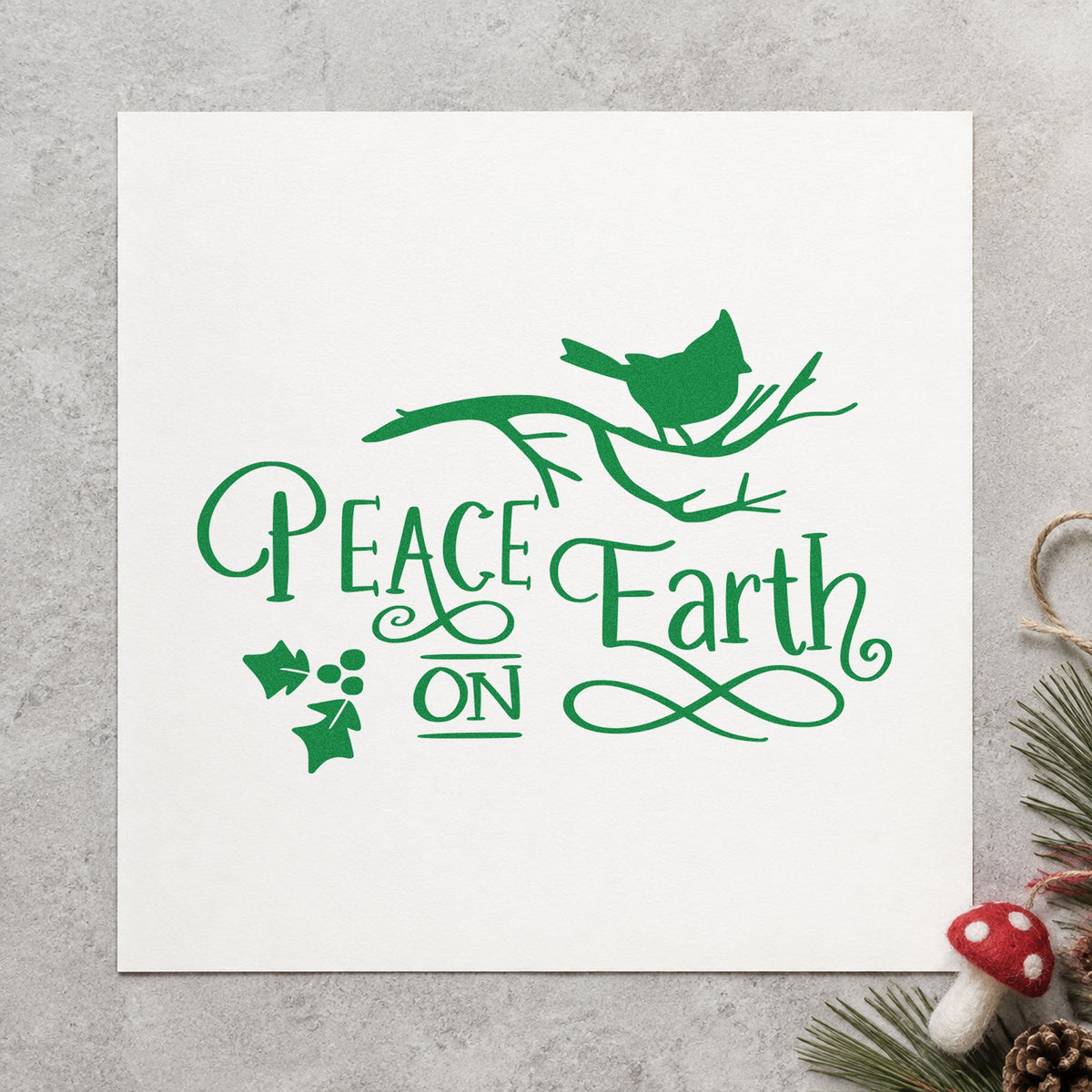 Peace On Earth Bird Branch craft stamp imprinted in green ink on paper, a design suited to framed window seat.