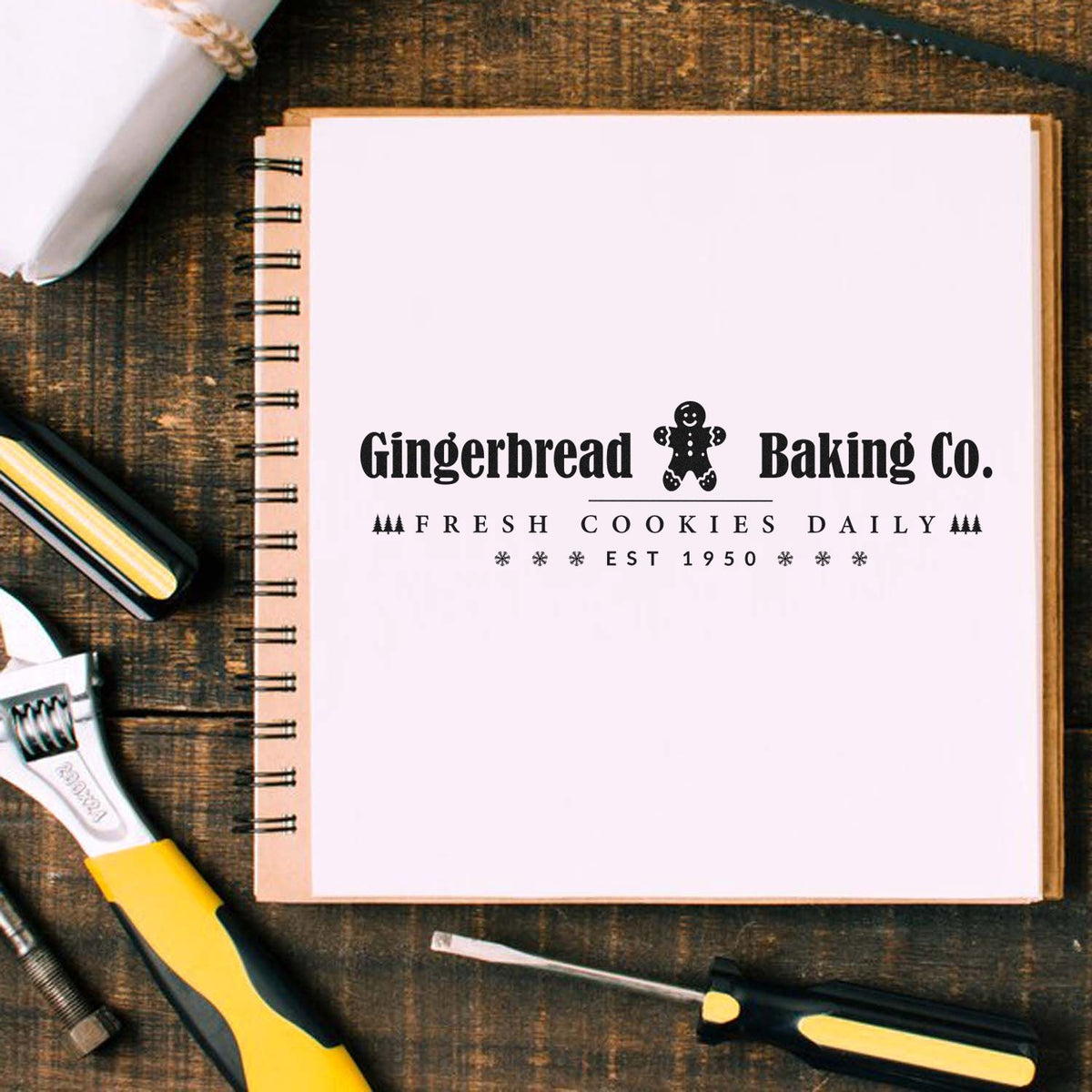 Gingerbread Baking Company Horizontal Premium Wooden Stamp - Vintage Pro imprint stamped in black ink. The words "Gingerbread Baking Co." flank a gingerbread figure above "fresh cookies daily" and "est 1950."