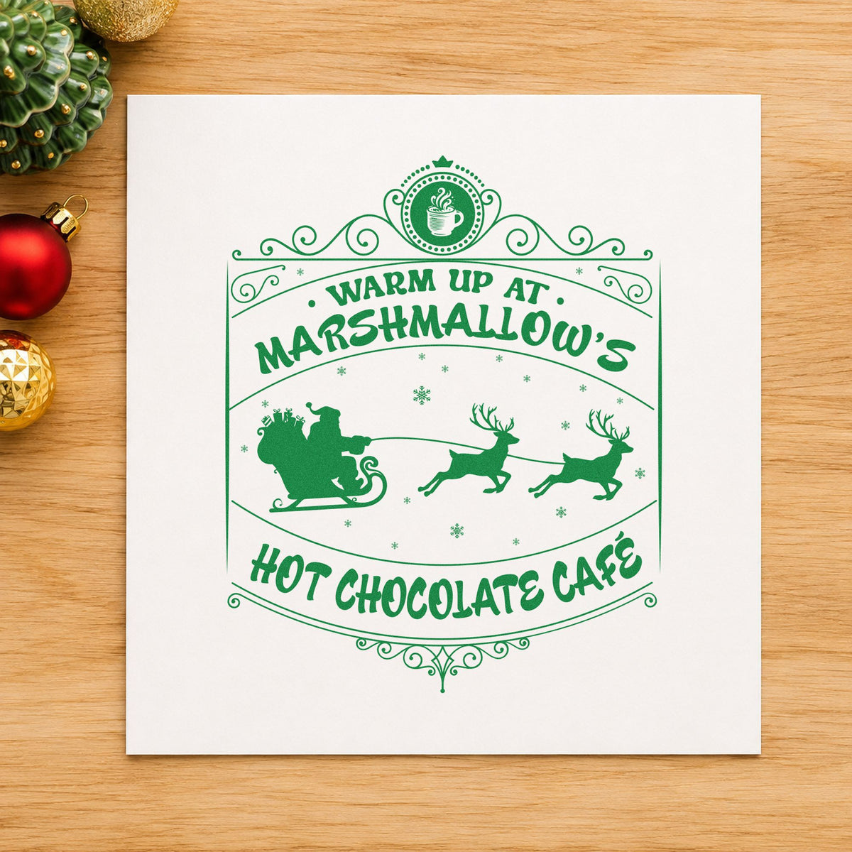 Marshmallow Hot Chocolate Cafe craft stamp imprinted in green ink on paper, a design suited to framed cafe window.
